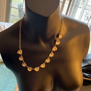 Stella & Dot gold and pink necklace. Super cute charms